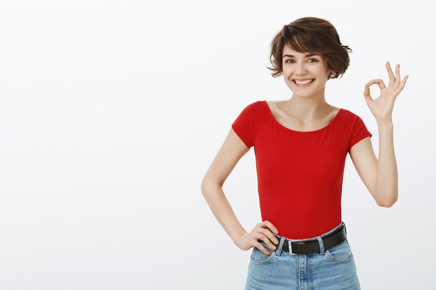 Short hair girl posing in red tshirt