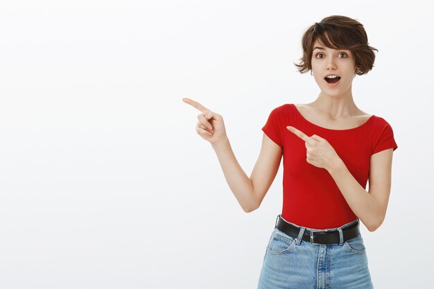 Short hair girl posing in red tshirt