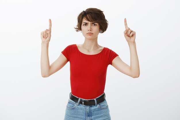 Short hair girl posing in red tshirt