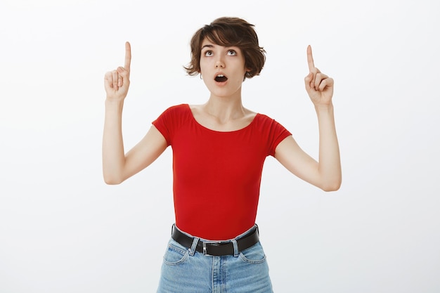 Short hair girl posing in red tshirt