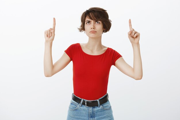 Short hair girl posing in red tshirt