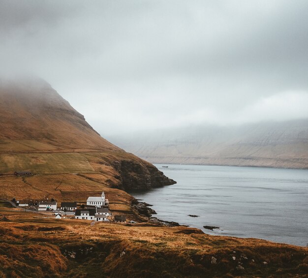 Shot of the beautiful nature such as the town, the sea and  mountains of the Faroe Islands