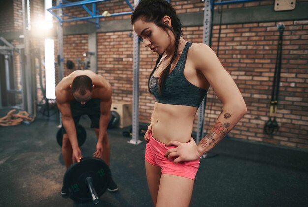 Shot of fit couple working out in gym