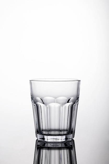 Free photo shot of a glass of water on a white background