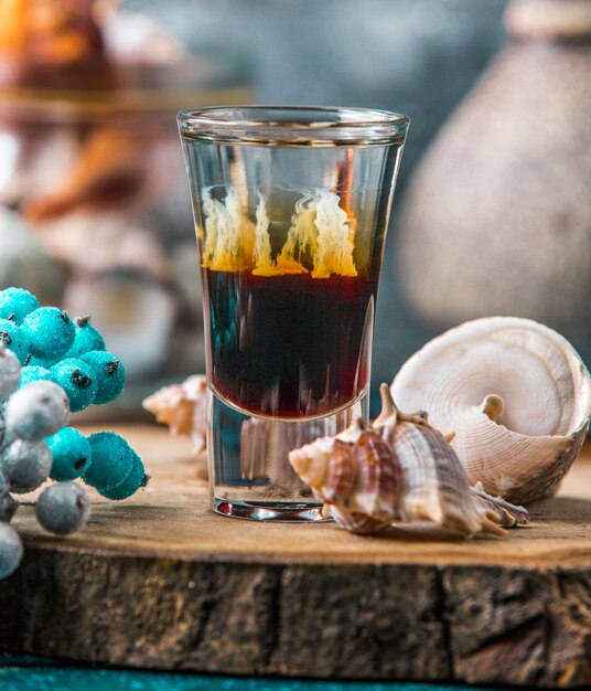 shot of ombre drink decorated with shells