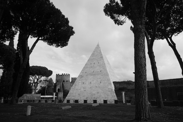 Free photo a shot of a pyramid and a castle in a forest