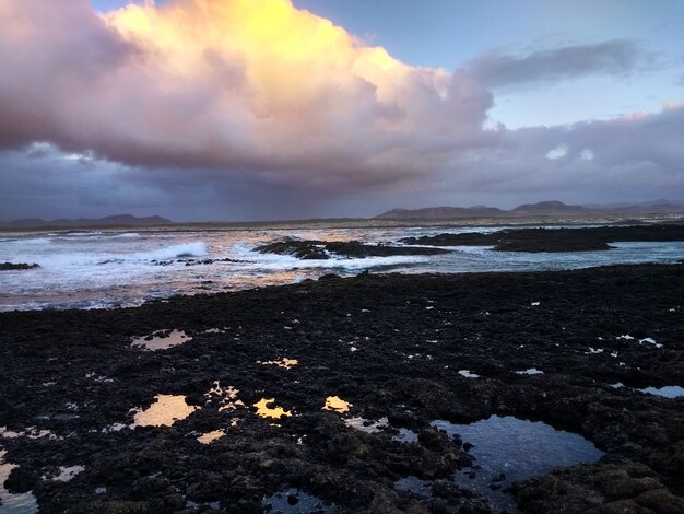 Shot of a rocky beach during the sunset in Fuerteventura, Spain.