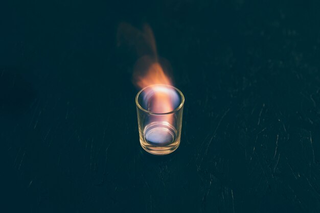 Shot of tequila glass on fire