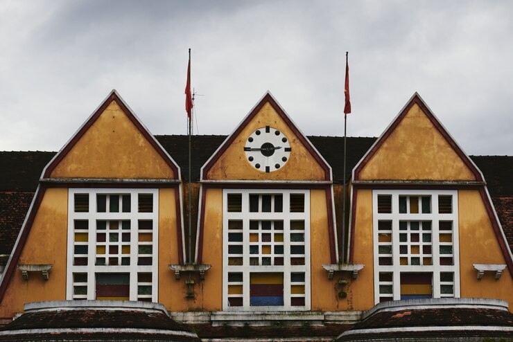 Free Photo shot of the train station roof with clocks showing quarter to three