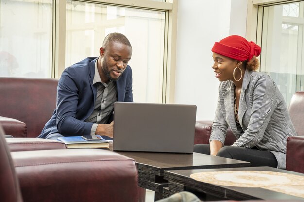 shot of two business colleagues in a small business meeting