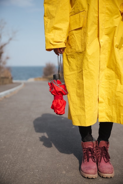 Free photo shot of umbrella and woman legs