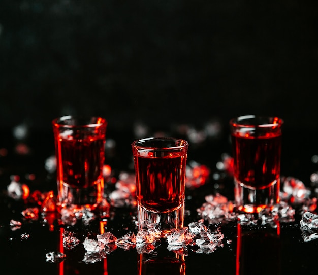 Free photo shots with red drinks on the table