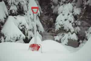 Free photo shovel in a snowy landscape