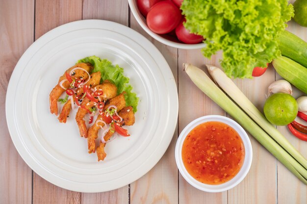 Shrimp deep-fried batter arranged beautifully in a white dish.