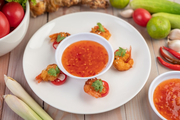 Shrimp deep-fried batter arranged beautifully in a white dish.