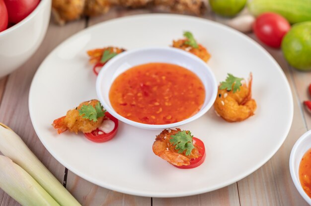 Shrimp deep-fried batter arranged beautifully in a white dish.