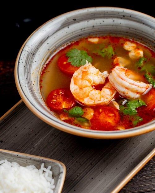 Shrimp soup with tomatoes and greens