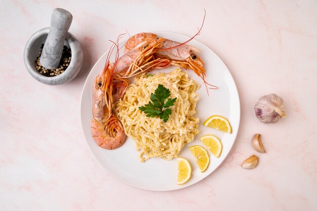 Shrimps and spaghetti in flat lay