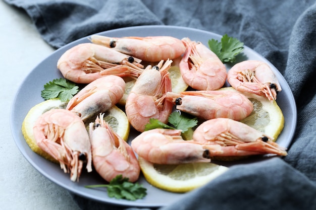 Shrimps with lemon on a plate