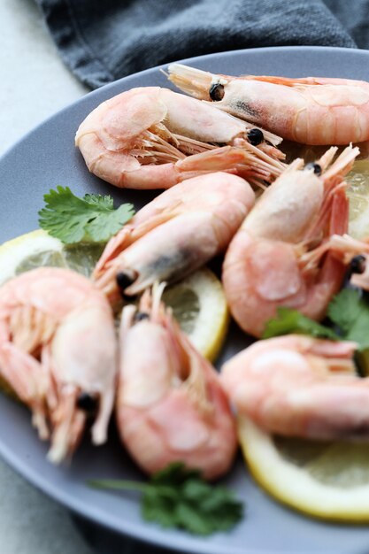 Shrimps with lemon on a plate