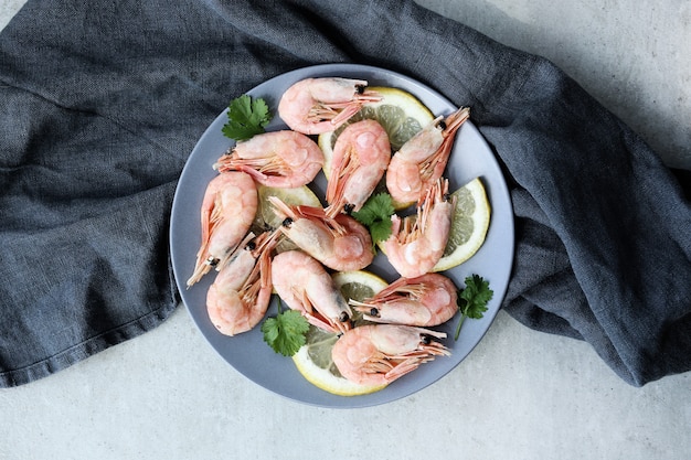 Shrimps with lemon on a plate