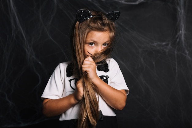 Shy girl in cat costume