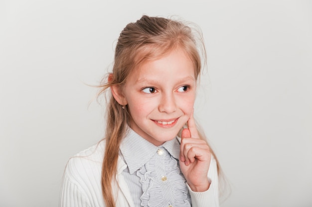 Free photo shy little girl is smiling