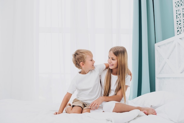 Siblings spending time together indoors 