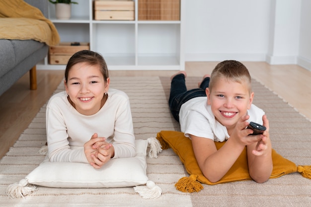 Free photo siblings watching television together