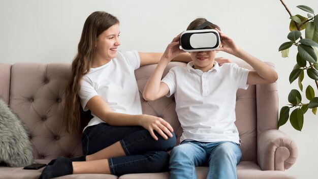 Siblings with virtual reality headset