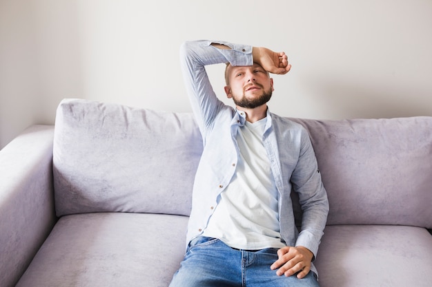 Sick male on couch