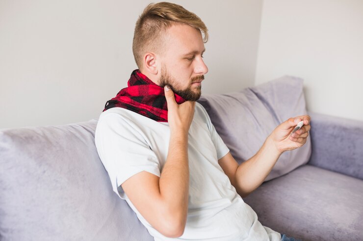 Free Photo sick man holding hand on neck