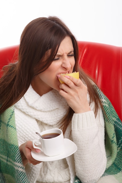 Free photo sick teenager biting a lemon