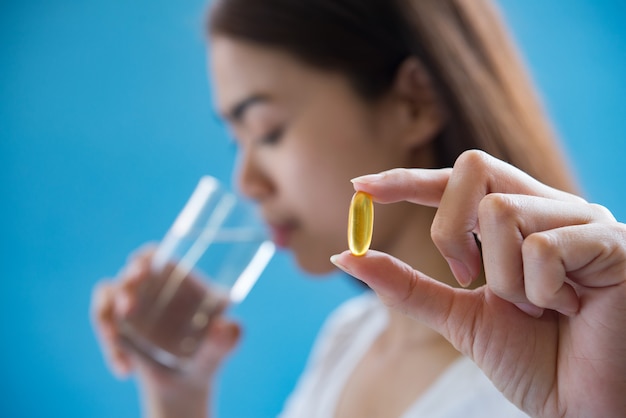 sick woman taking medicine