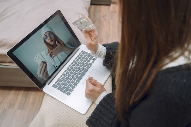 Free photo sick woman with headache sitting at home