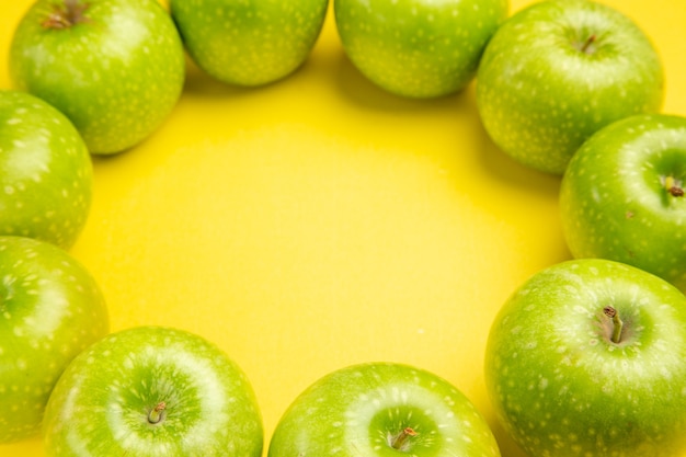 Side close-up view apples the appetizing green apples are laid out in a circle