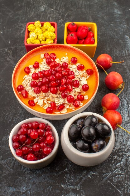 Side close-up view berries oatmeal pomegranate candies colorful berries