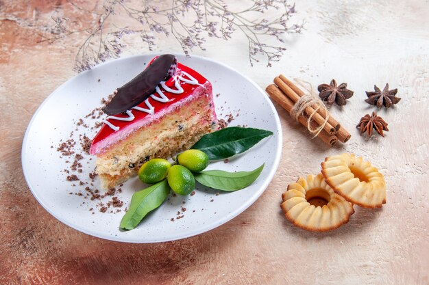 Side close-up view a cake an appetizing cake cookies star anise cinnamon sticks