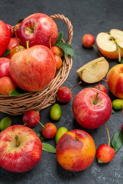 Side close-up view fruits different berries fruits basket of fruits