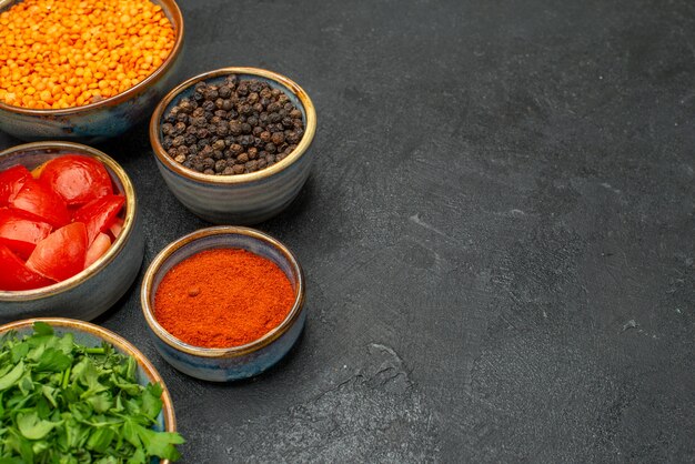 Side close-up view lentil an appetizing lentil herbs tomatoes black pepper spices