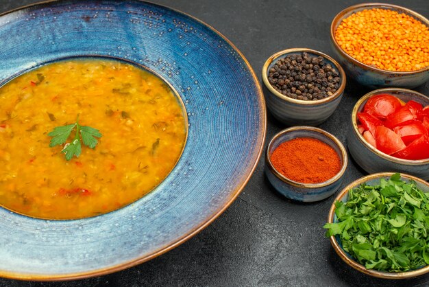 Side close-up view lentil soup lentil soup spices tomatoes lentil herbs in the bowls