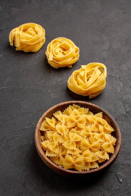 Side close-up view pasta appetizing pasta on the dark wall