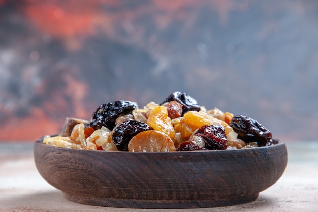 Free photo side close-up view pilaf an appetizing rice with chestnuts on the table