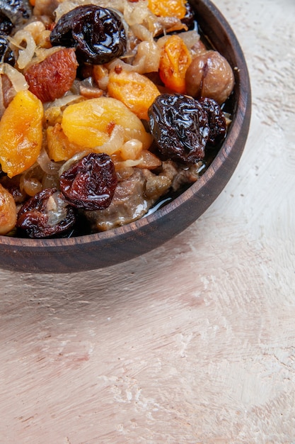 Side close-up view pilaf rice with dried fruits on the table