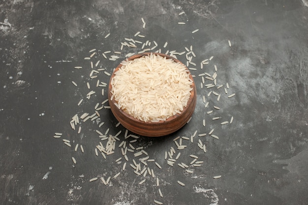 Side close-up view rice bowl of rice on the dark table