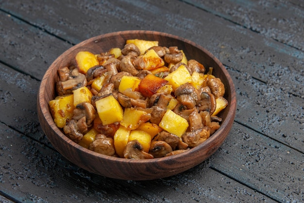 Side close view plate with potatoes mushrooms plate with potatoes and mushrooms in the center of the table