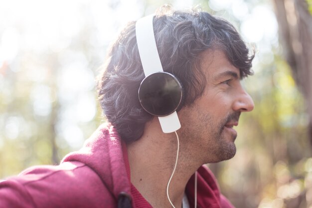 Side view of active man with headphones