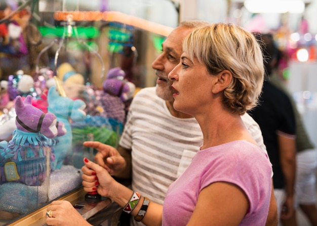 Side view adults in amusement park