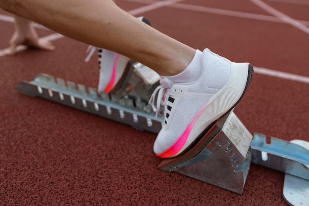 Free photo side view athlete at running starting line