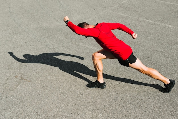 Side view of athlete stretching